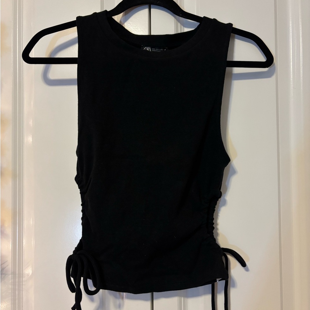 Woman’s Zara black tank top with side cut outs